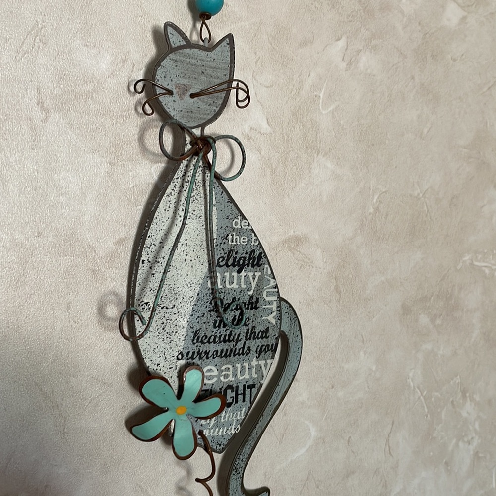 Hanging, dangling  metal cat